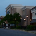 Evening photo of Ross Dress for Less and Rue 21 storefronts