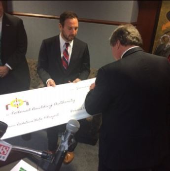 Men signing a check to be presented