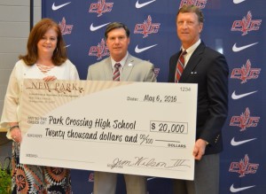 Anita Carter and Carl Bartlett presenting a check to Park Crossing High School
