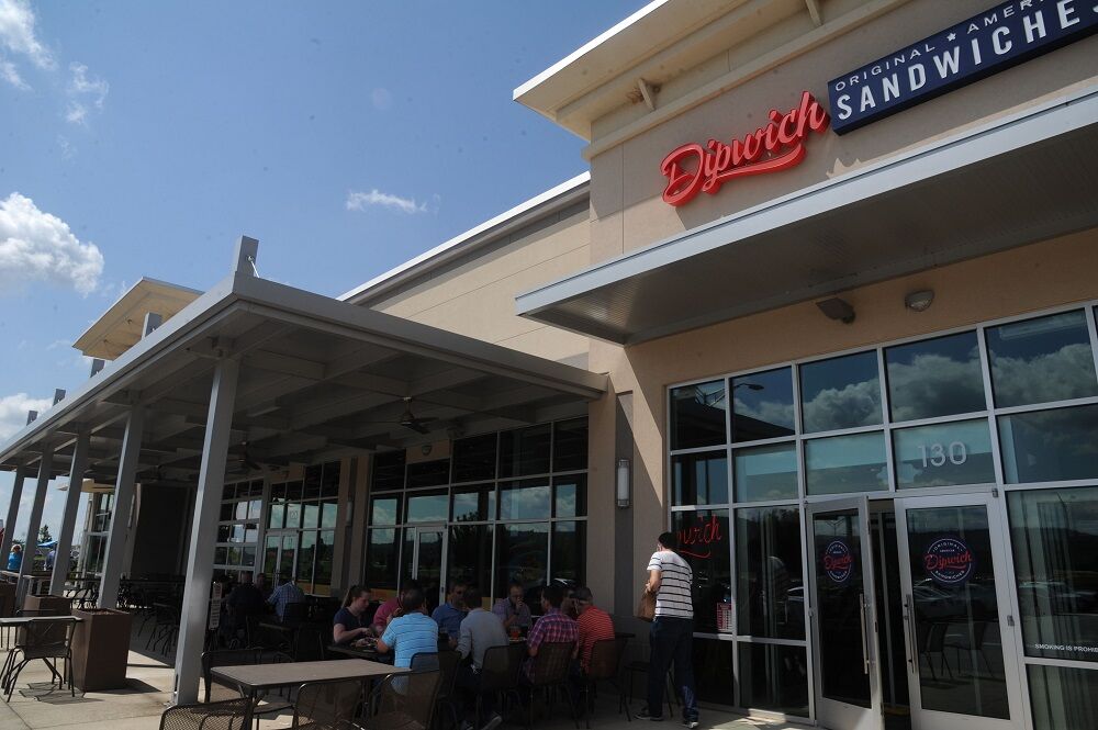 People sitting outside of a restaurant