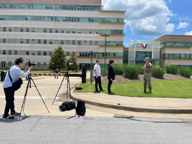 The KBS news team interviews Redstone Arsenal Senior Commander and Army Materiel Command's acting Commanding General in front of AMC headquarters on Redstone Arsenal. (Photo Credit: Lisa Simunaci)