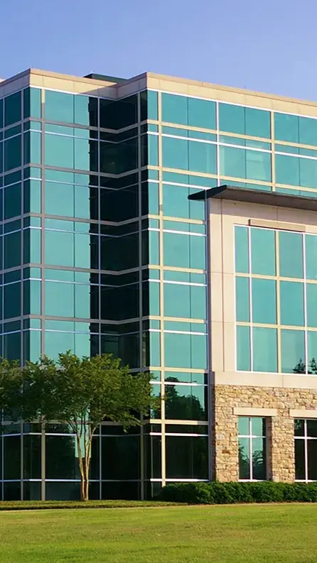Lakeview: Modern commercial building with glass windows and stone facade