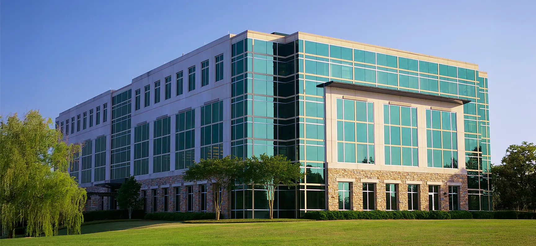 Lakeview: Modern commercial building with glass windows and stone facade